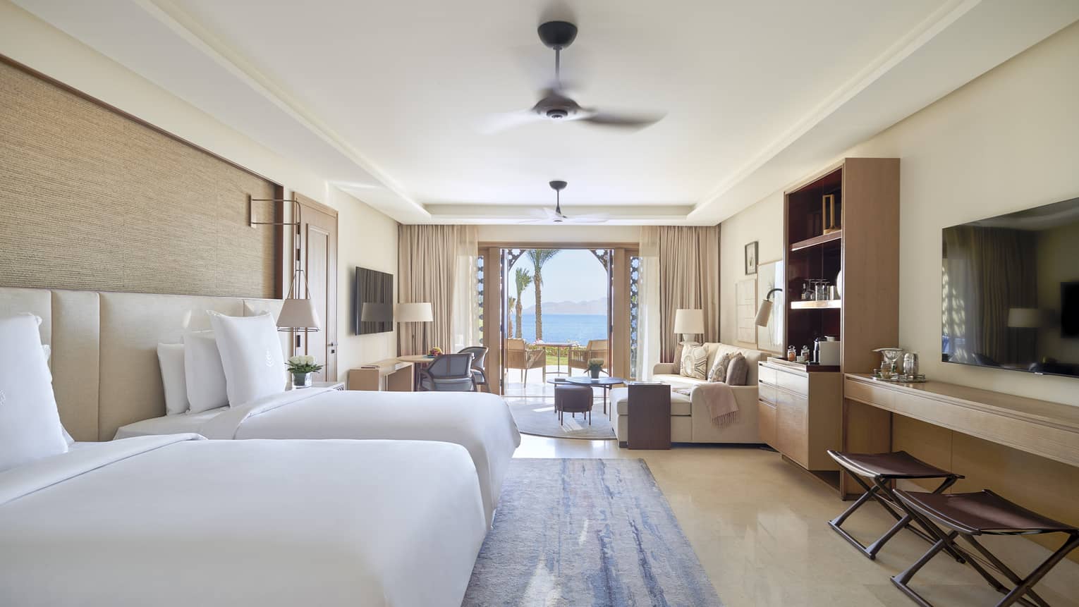 Bedroom with two beds and walk-out terrace