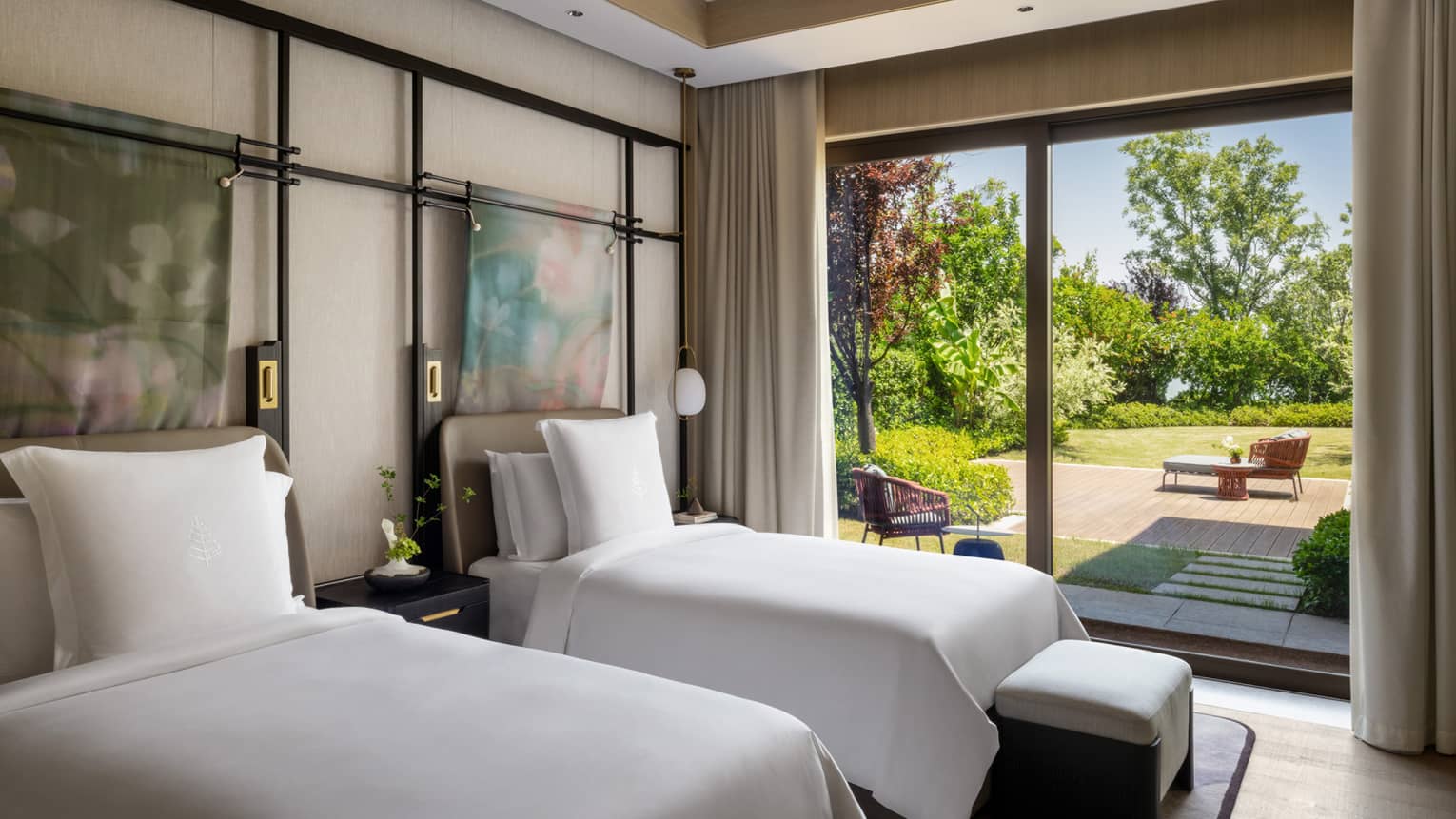 Luxury hotel bedroom with two single beds and walk-out terrace at Four Seasons Hotel Suzhou