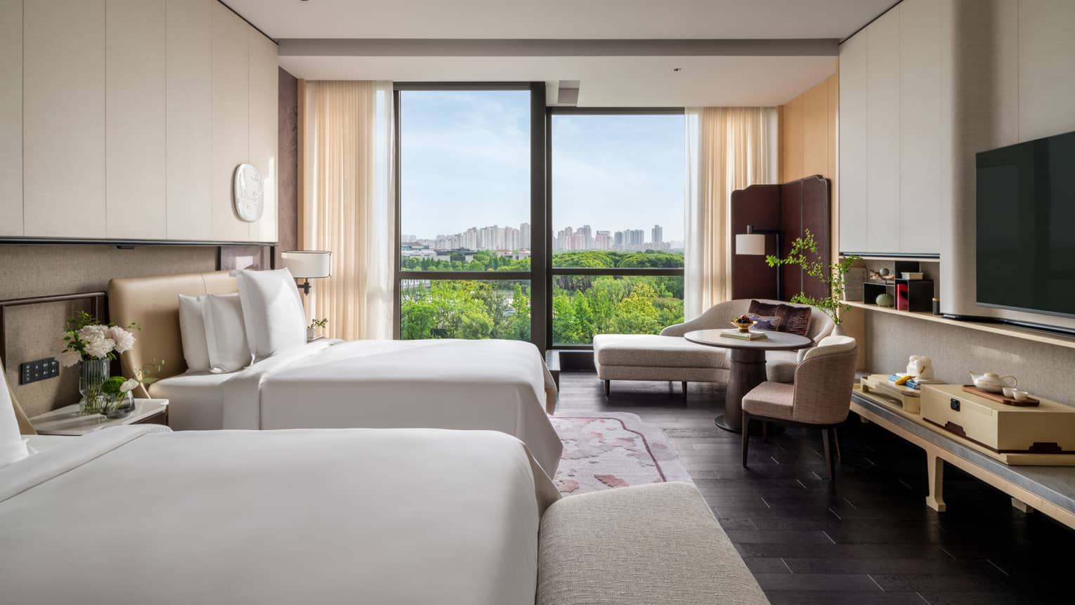 Luxury hotel room with two twin beds and garden view at Four Seasons Hotel Suzhou