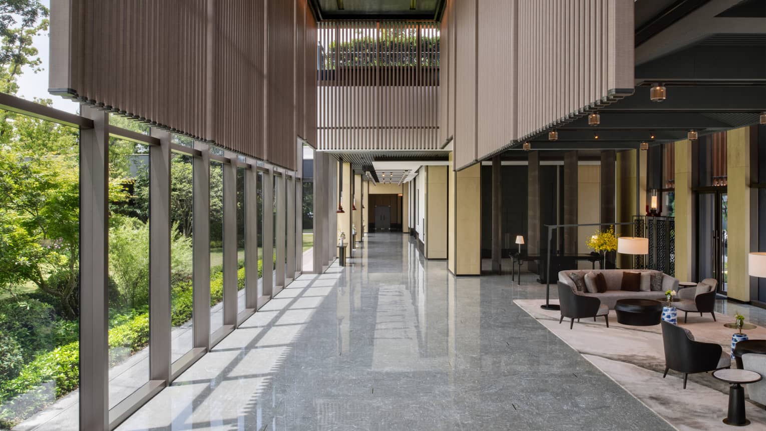 Ballroom foyer at Four Seasons Hotel Suzhou, with garden view and modern wooden architecture