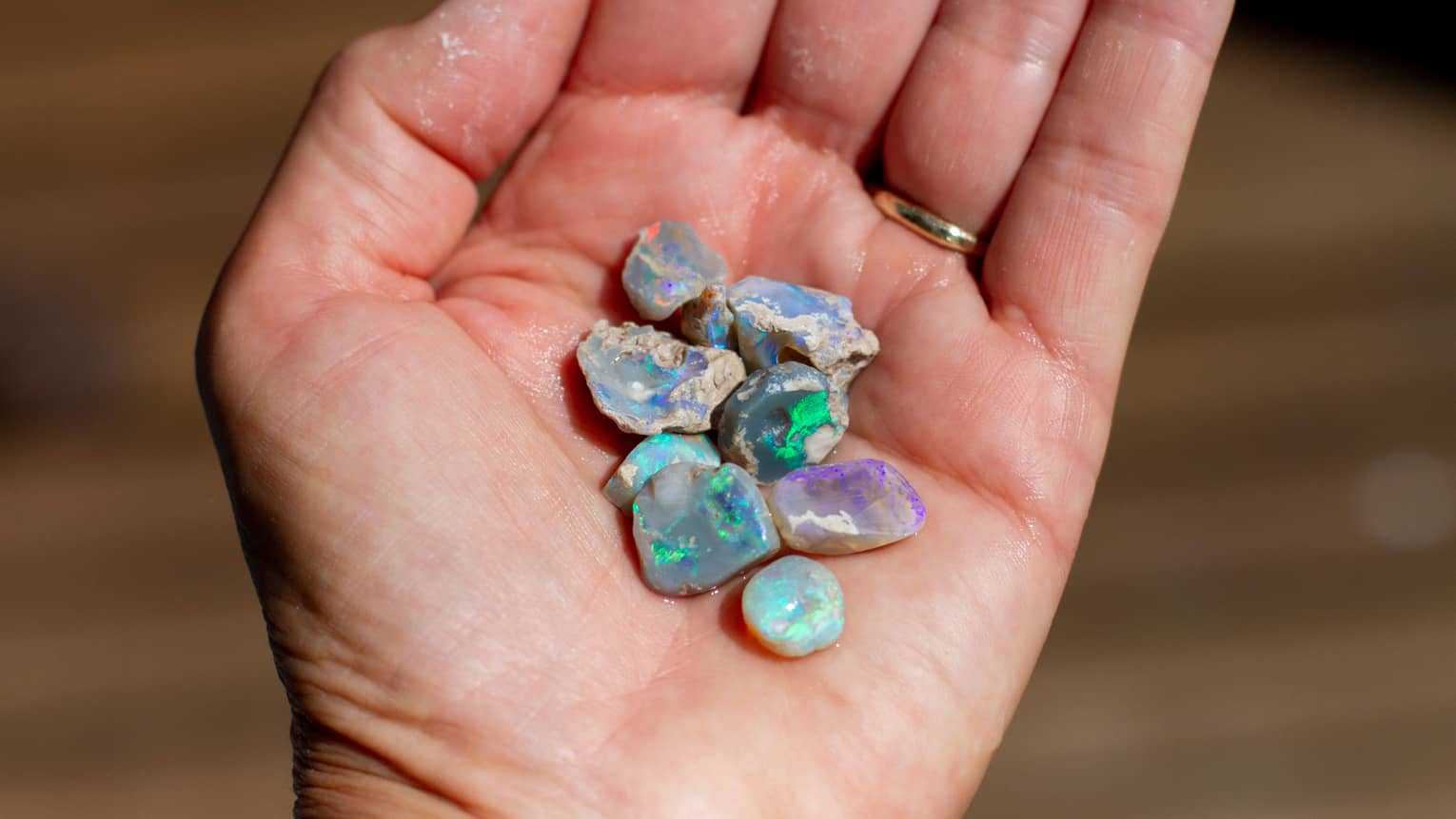 Open palm holds shimmery white gems