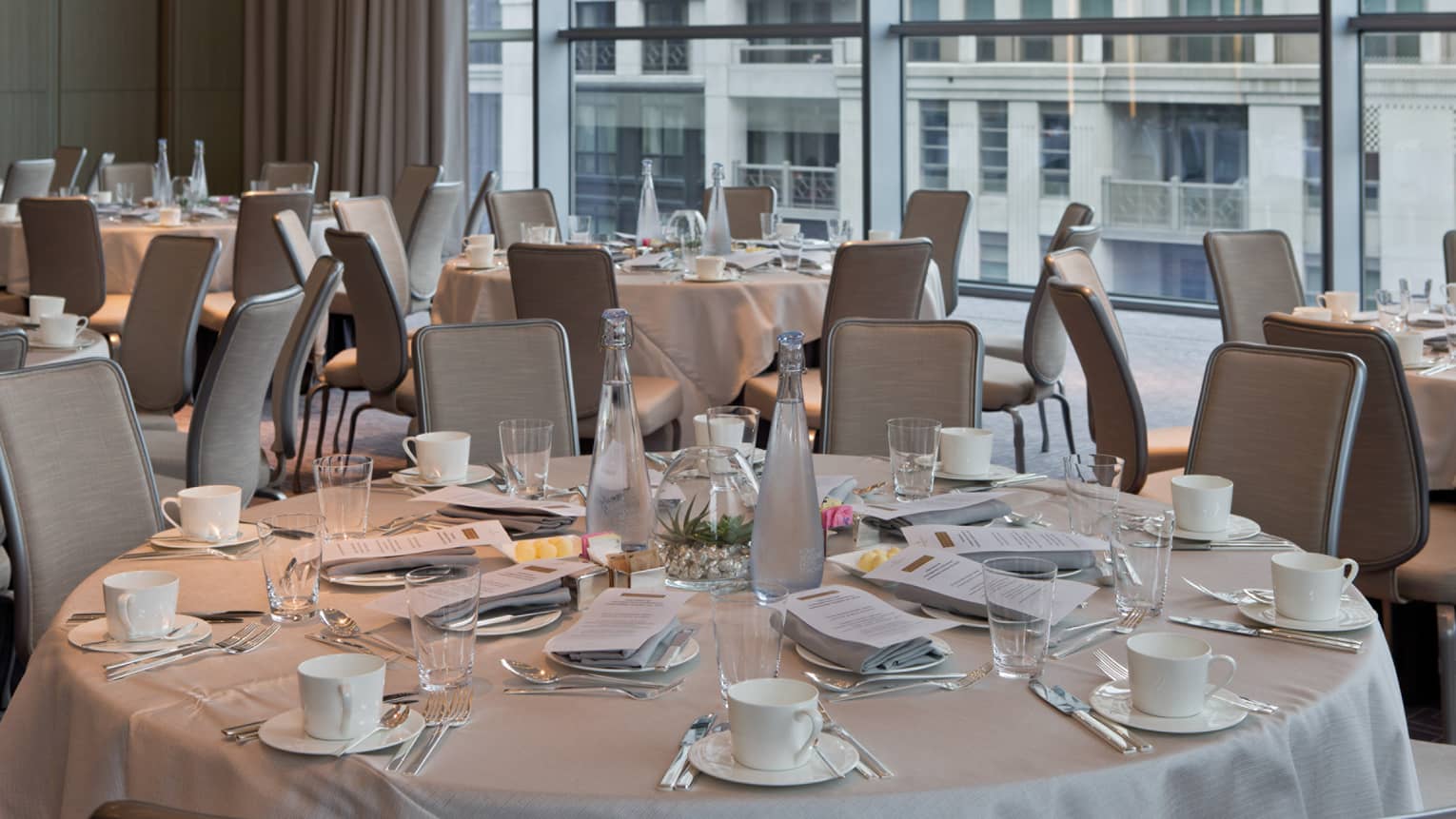 Vinci ballroom with round banquet dining tables set with coffee mugs