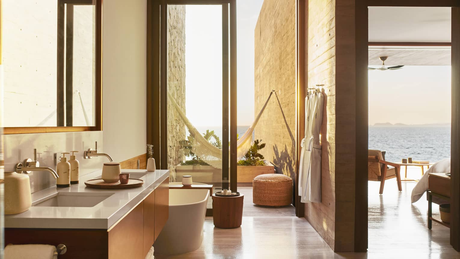 Modern, open bathroom with walk-out terrace and hammock