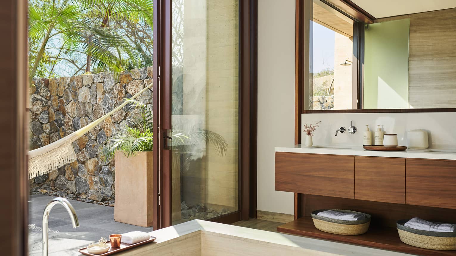 Modern, indoor-open bathroom with square tub