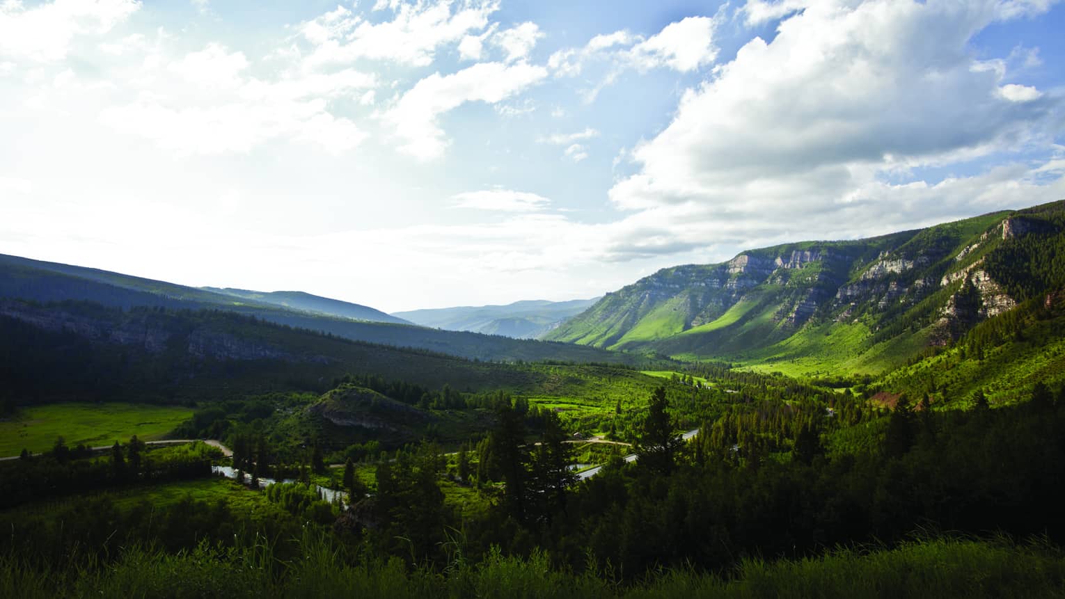 Aerial view of sweeping green mountain range