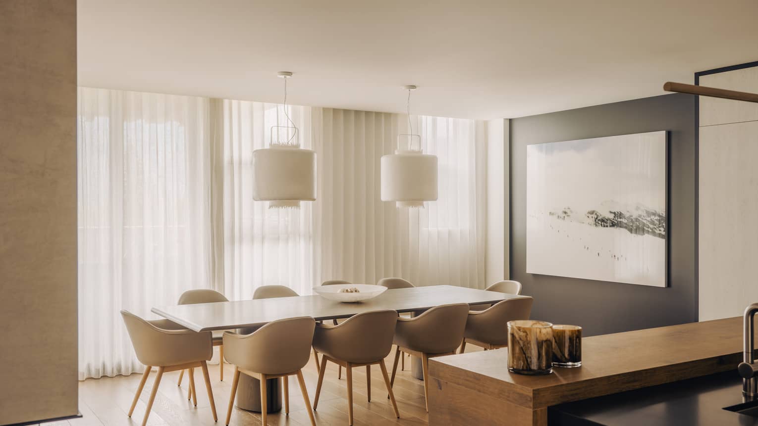 Modern dining room of a private residence, with a rectangular table seating 8