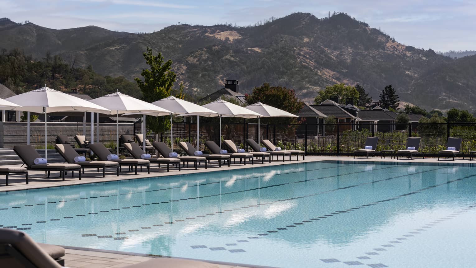 Olympic-sized swimming pool with mountains in the distance