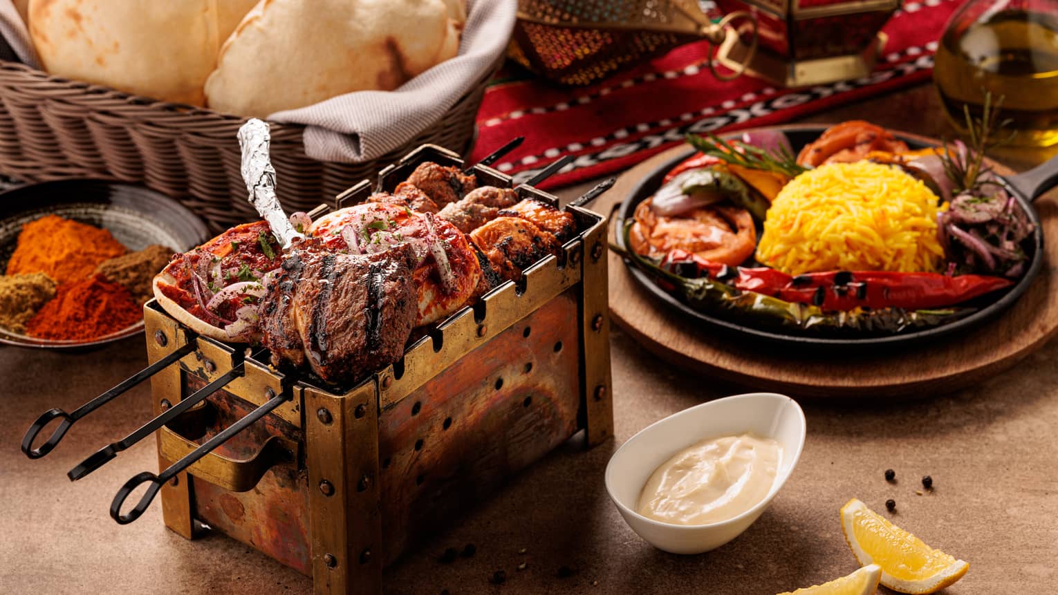 Shrimp roasting on skewers next to a large plate of rice.