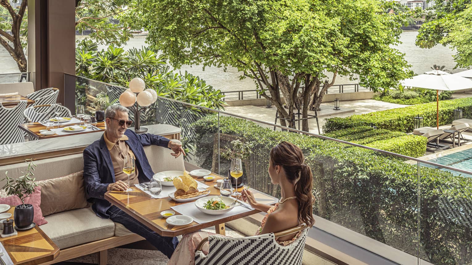 Couple enjoys a meal on the outdoor terrace at Riva