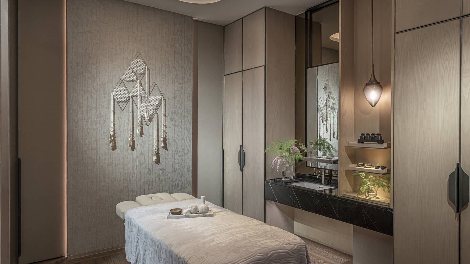 Private treatment room with single massage table