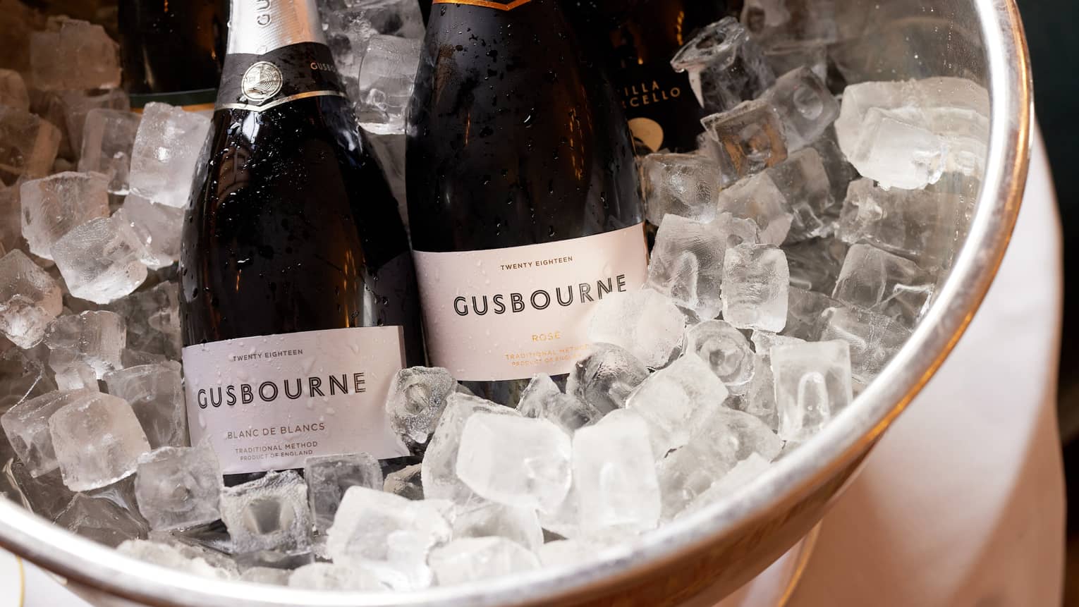 Two bottles of Gusbourne sparkling wine in ice bucket