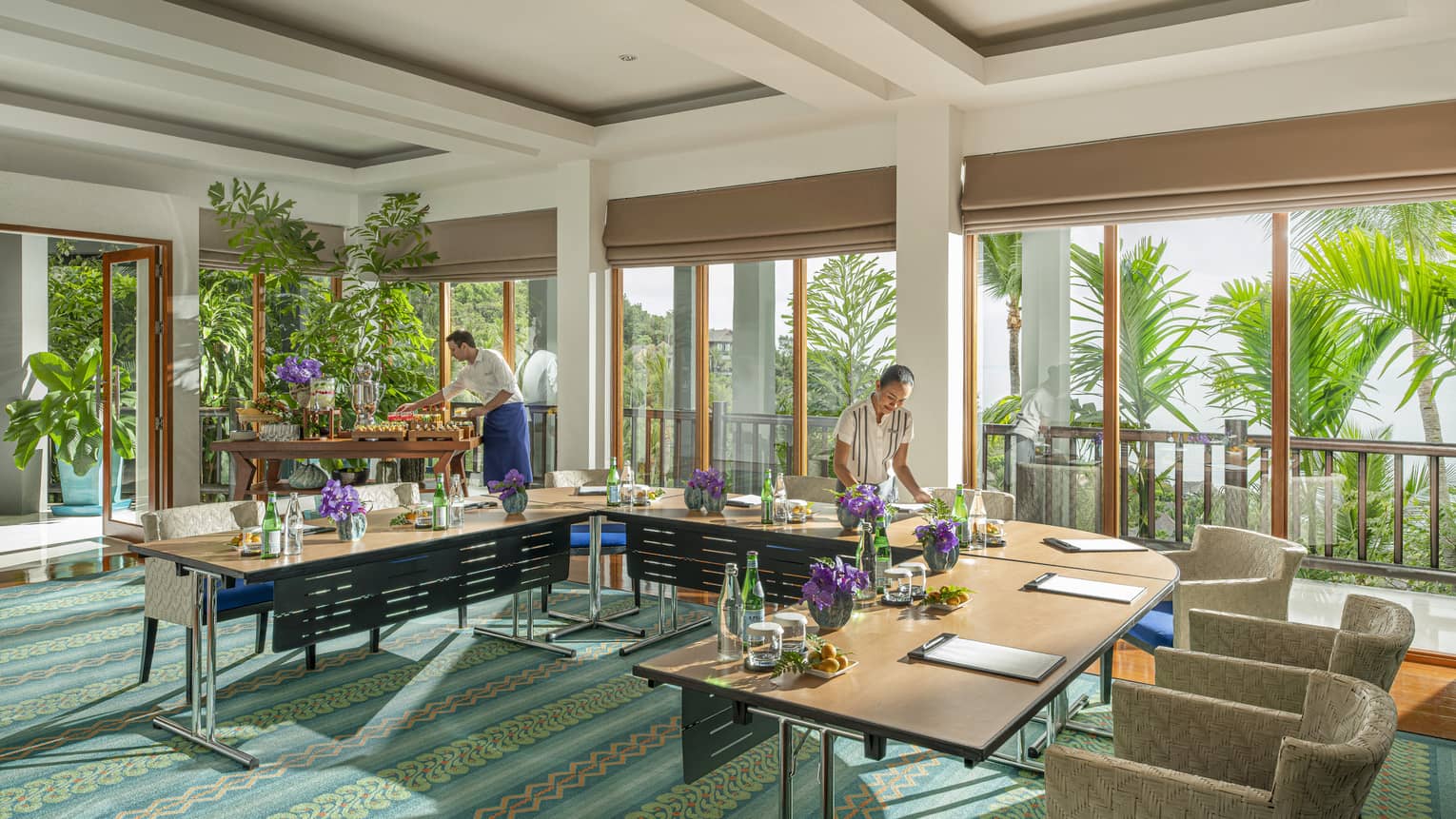 Chef and team member prepare Khob Fah meeting room for an event