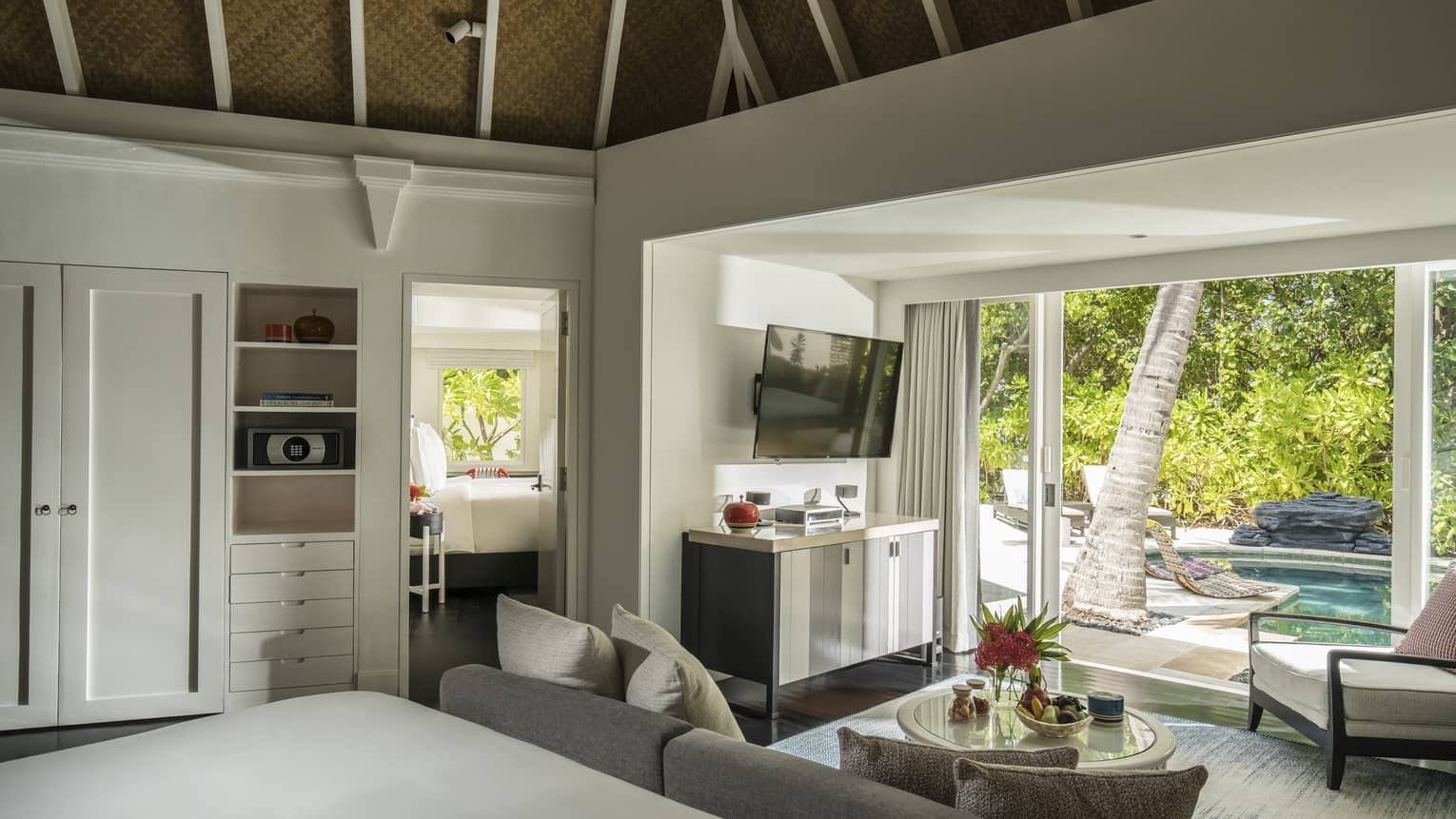 The lounge area of two bedroom pavilion with TV and sofa