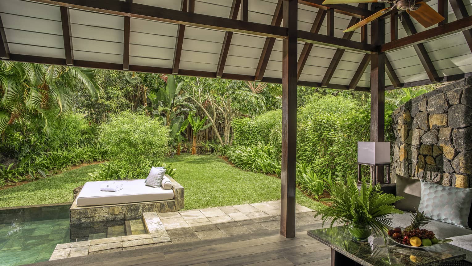Private terrace with vaulted pavilion covering, small pool and daybed, garden