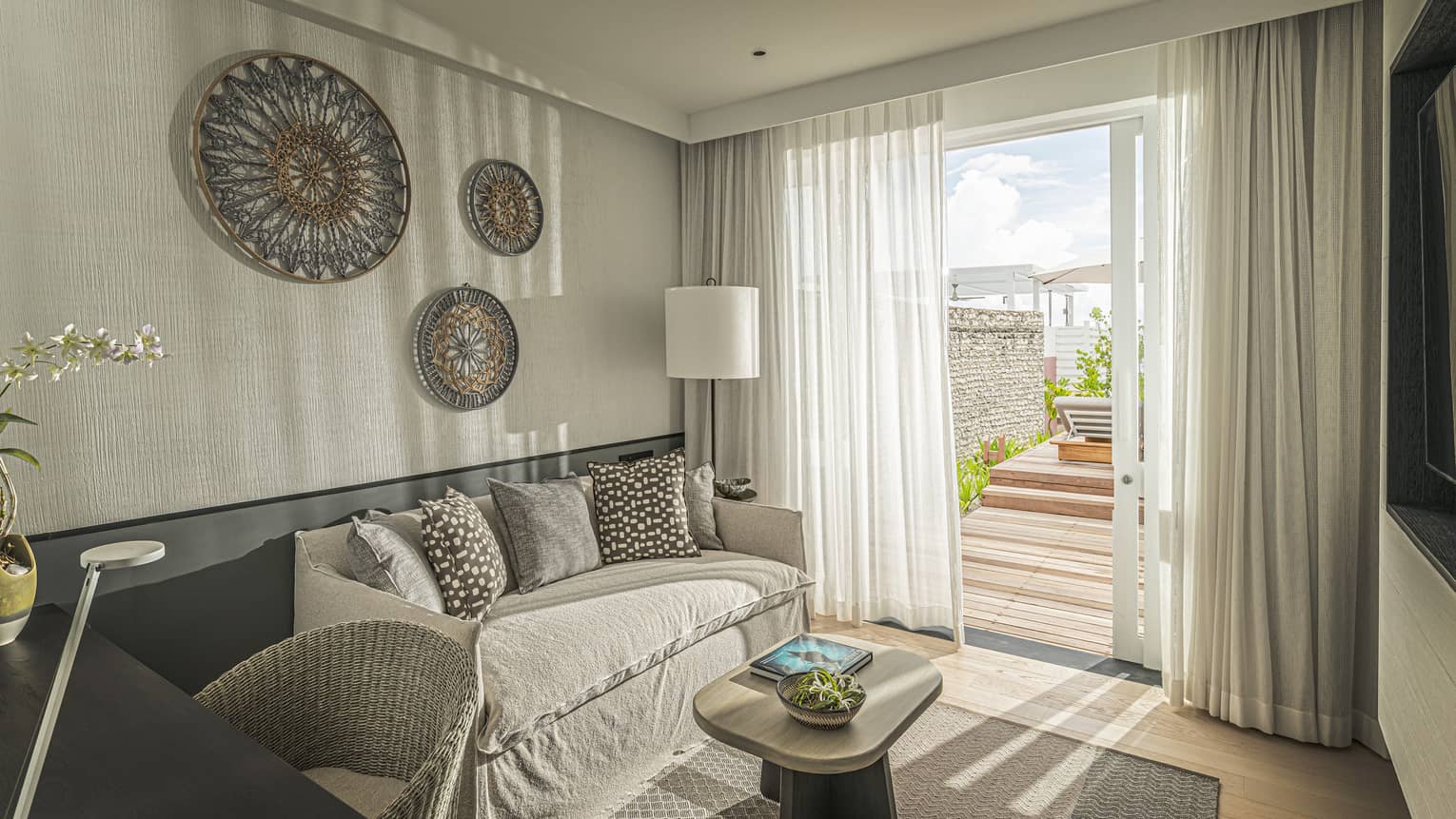 Family Ocean Front Bungalow with Pool living area with couch, door to terrace