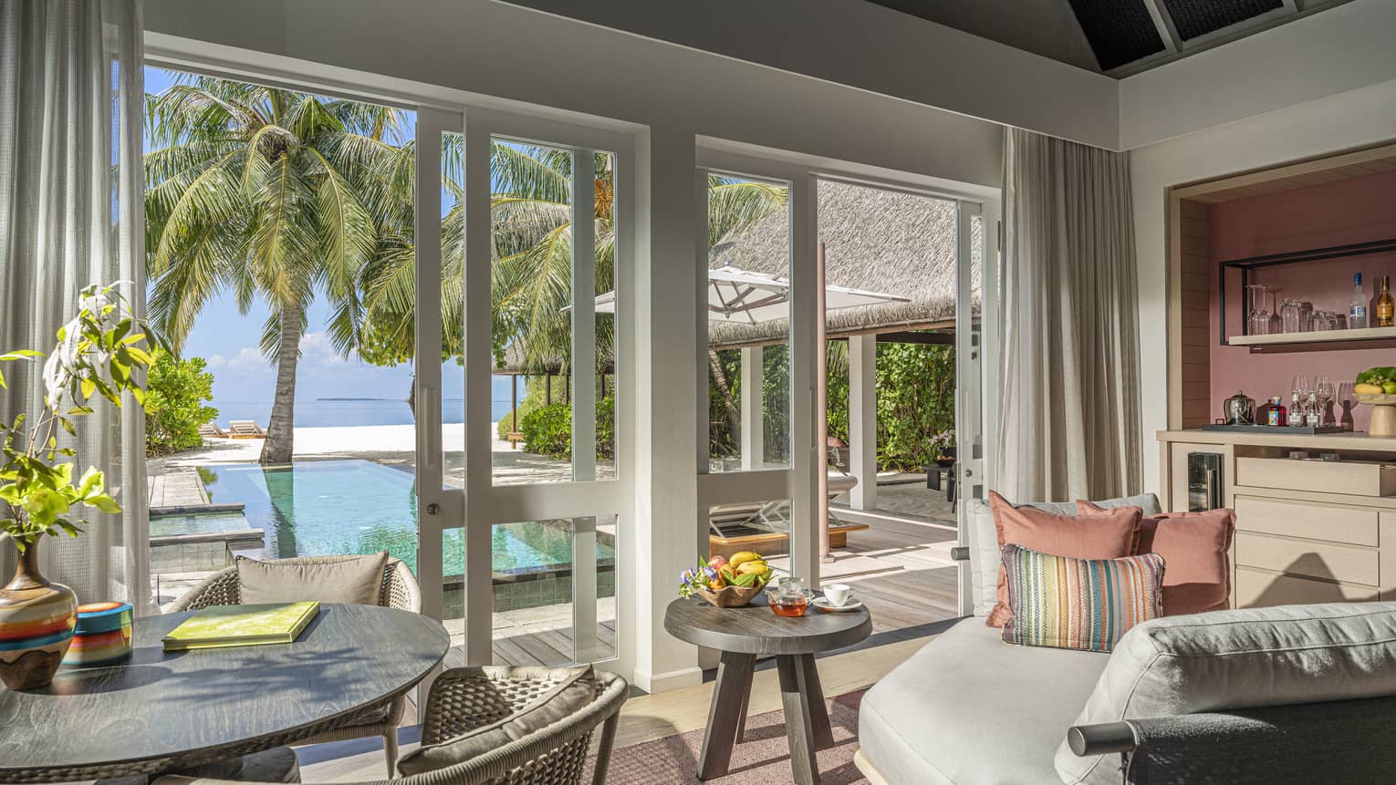 Indoor sitting area and wet bar, leading out to private pool terrace
