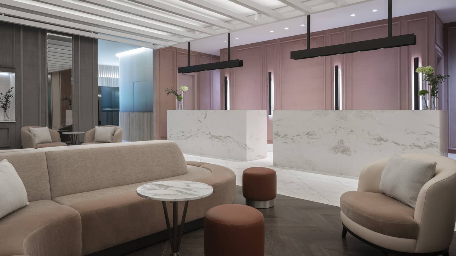Social area in lobby with marbled desks, modular sofa, chairs, marble table, ottomans 
