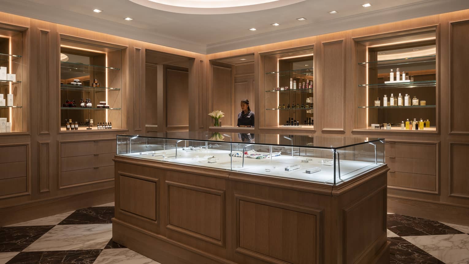 The spa reception area brightly lit by a large circular light. 