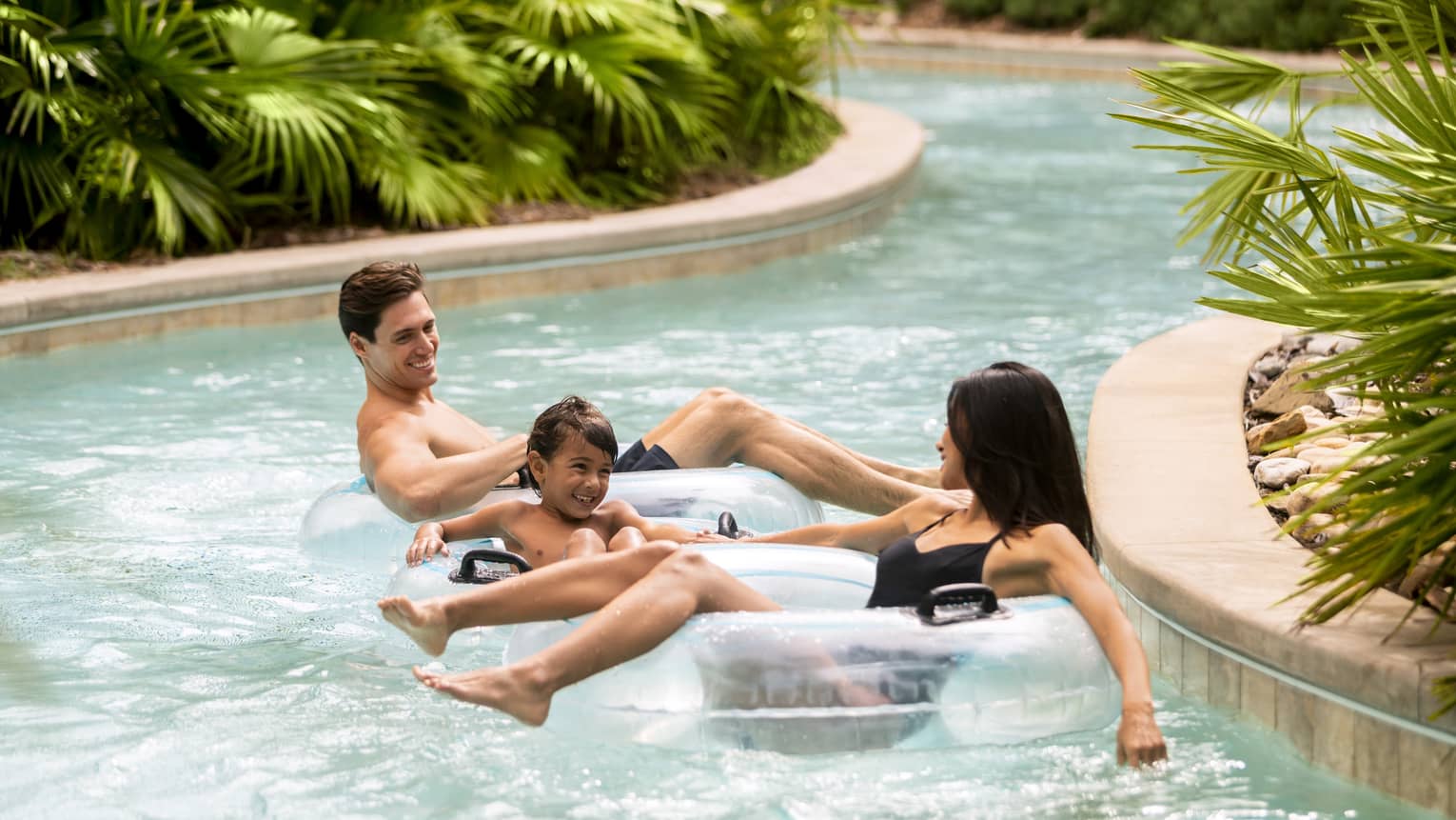 Family float down resort Lazy River in inflatable tubes