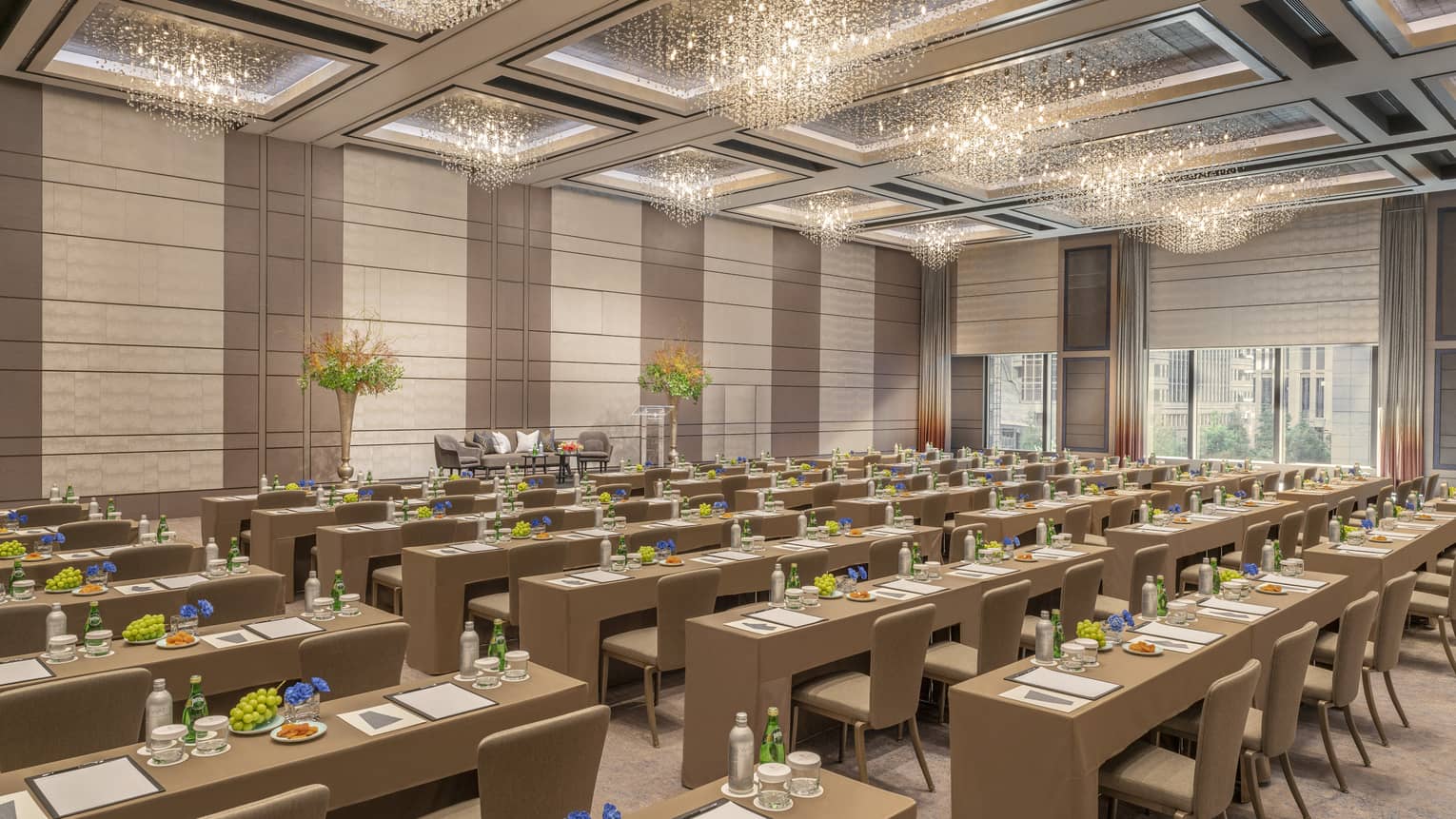 Ballroom set classroom style with gold accents and high ceilings