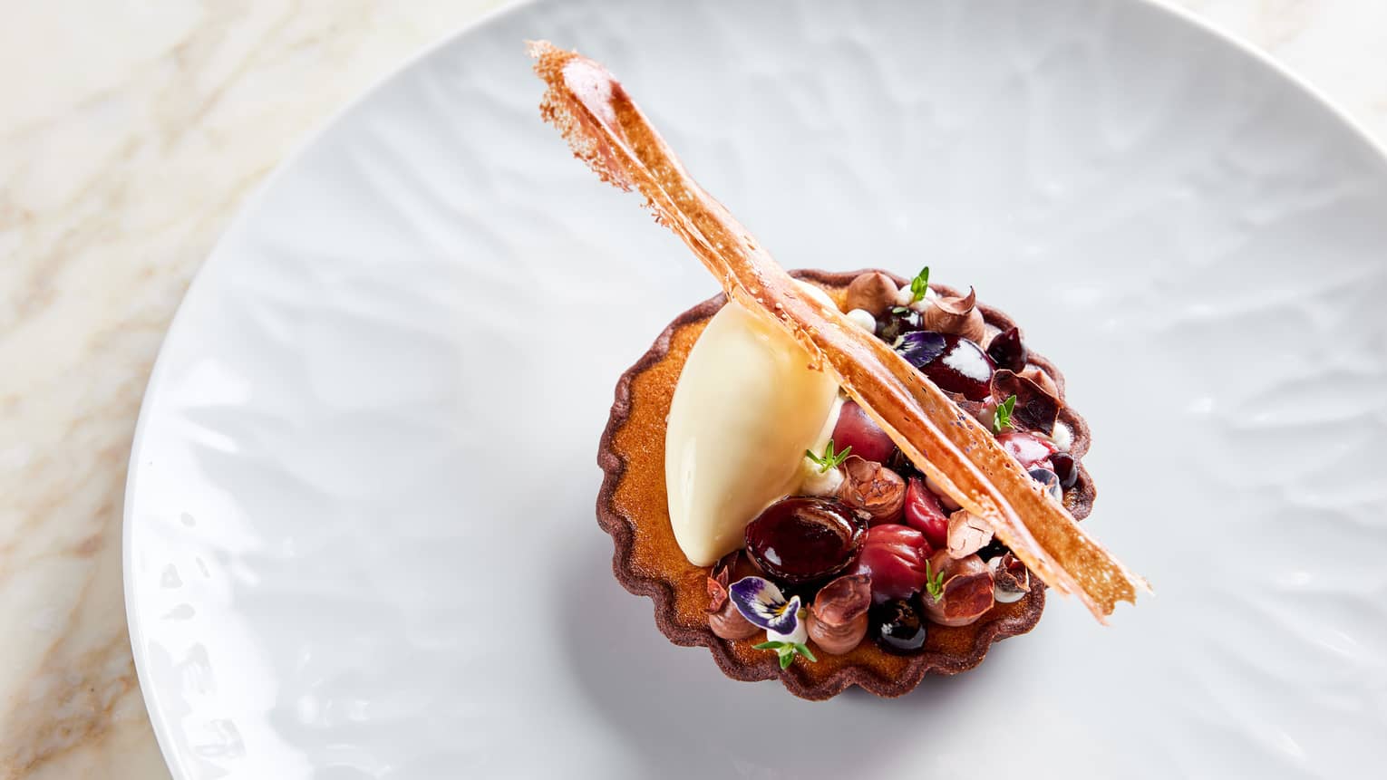 Cherry Clafoutis with Dark Chocolate Cr�meux, Thyme and Cream Cheese Ice Cream with Wafer garnish on white plate