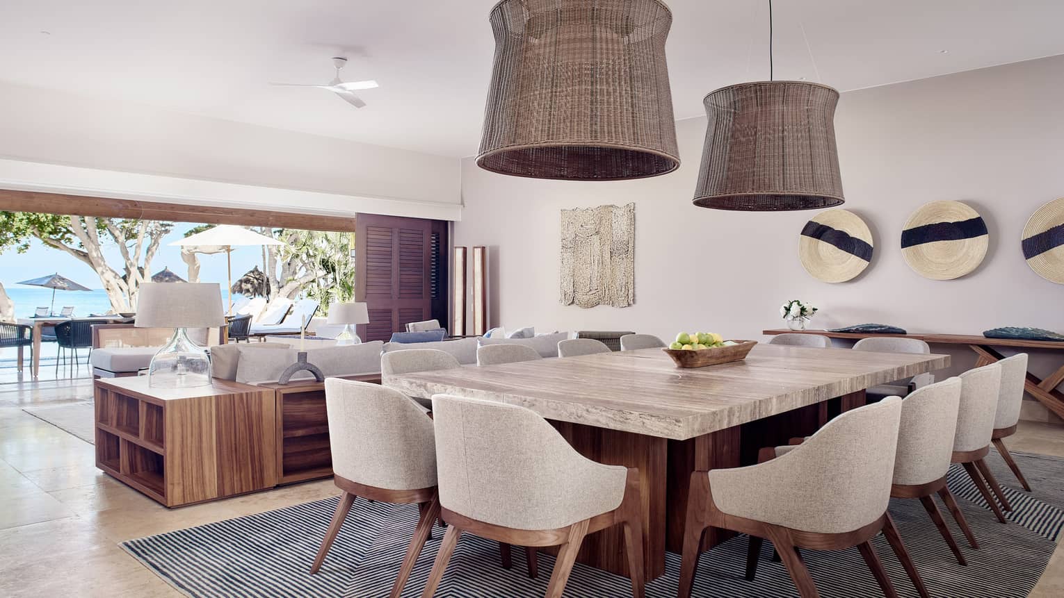 Modern living and dining area of a private villa in a tropical location