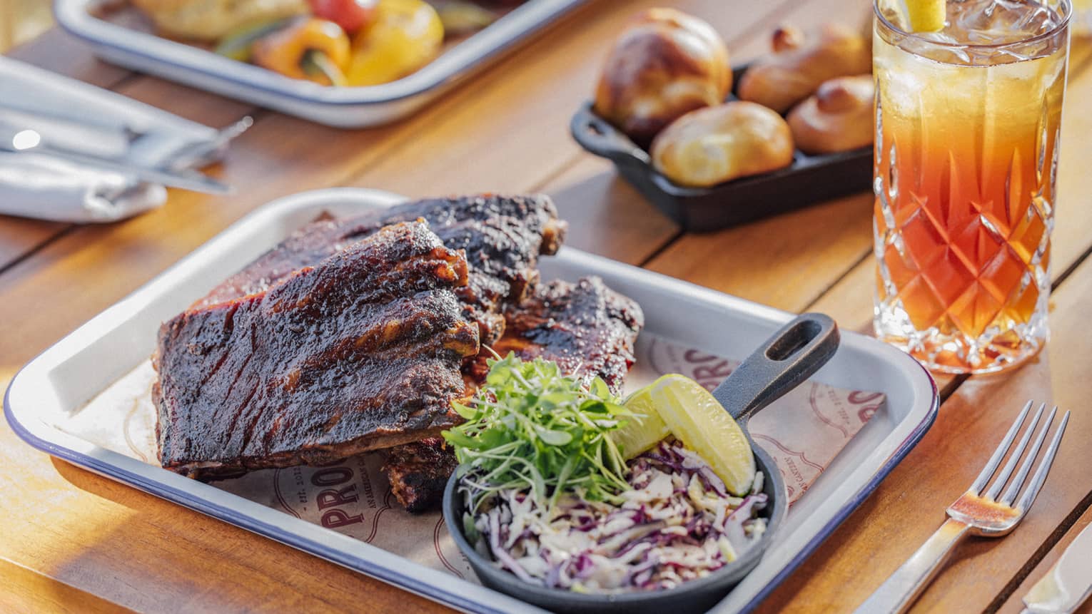 Half rack of glazed baby back ribs with cole slaw and tea