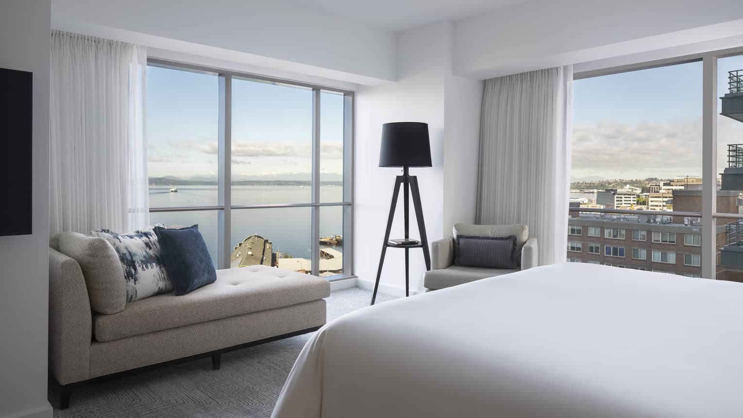 The well-lit Bay Suite overlooks boats sailing along Elliot Bay