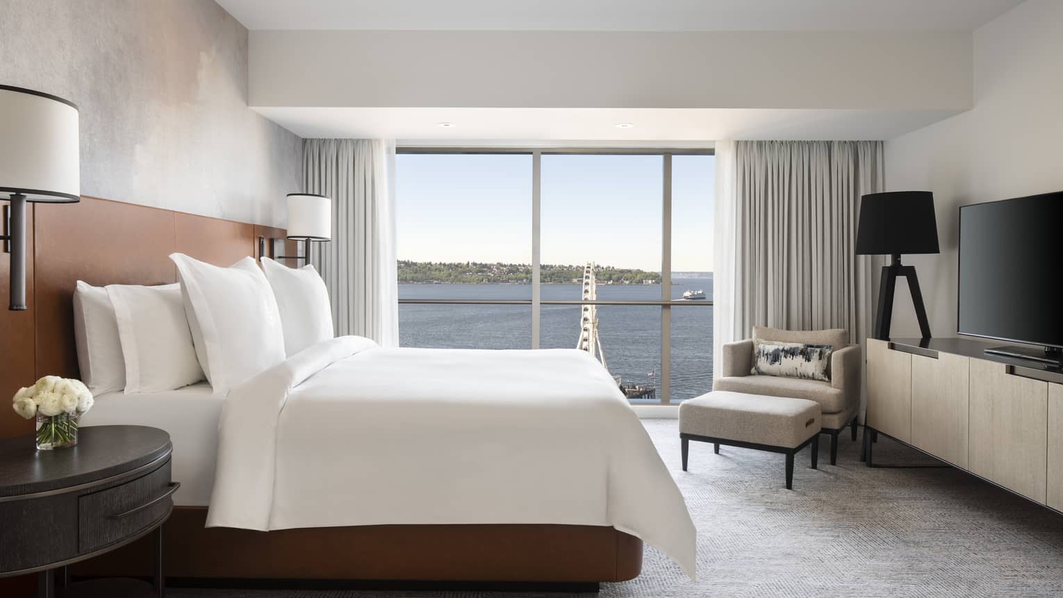 The Deluxe Elliot Bay Suite overlooks the Seattle Great Wheel