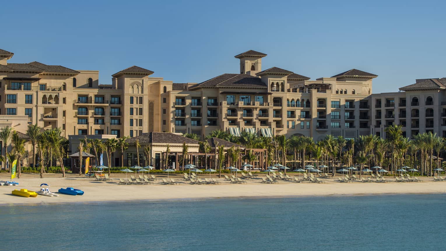 Exterior view of building, sand beach at Four Seasons Resort Dubai at Jumeirah Beach