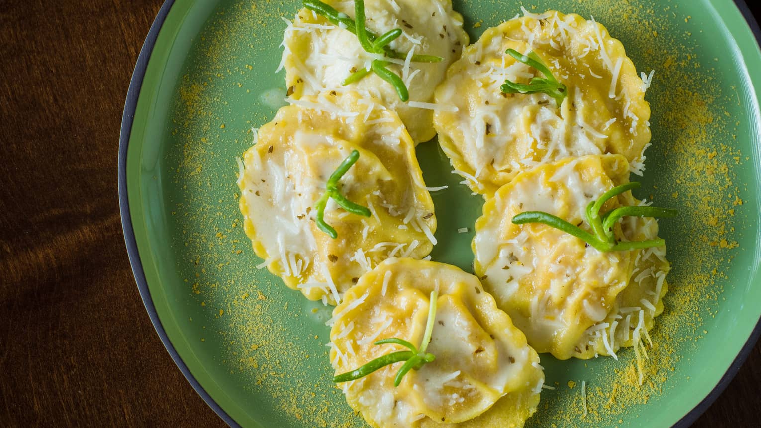 Stuffed ravioli topped with parmesan cheese and panko bread crumbs.