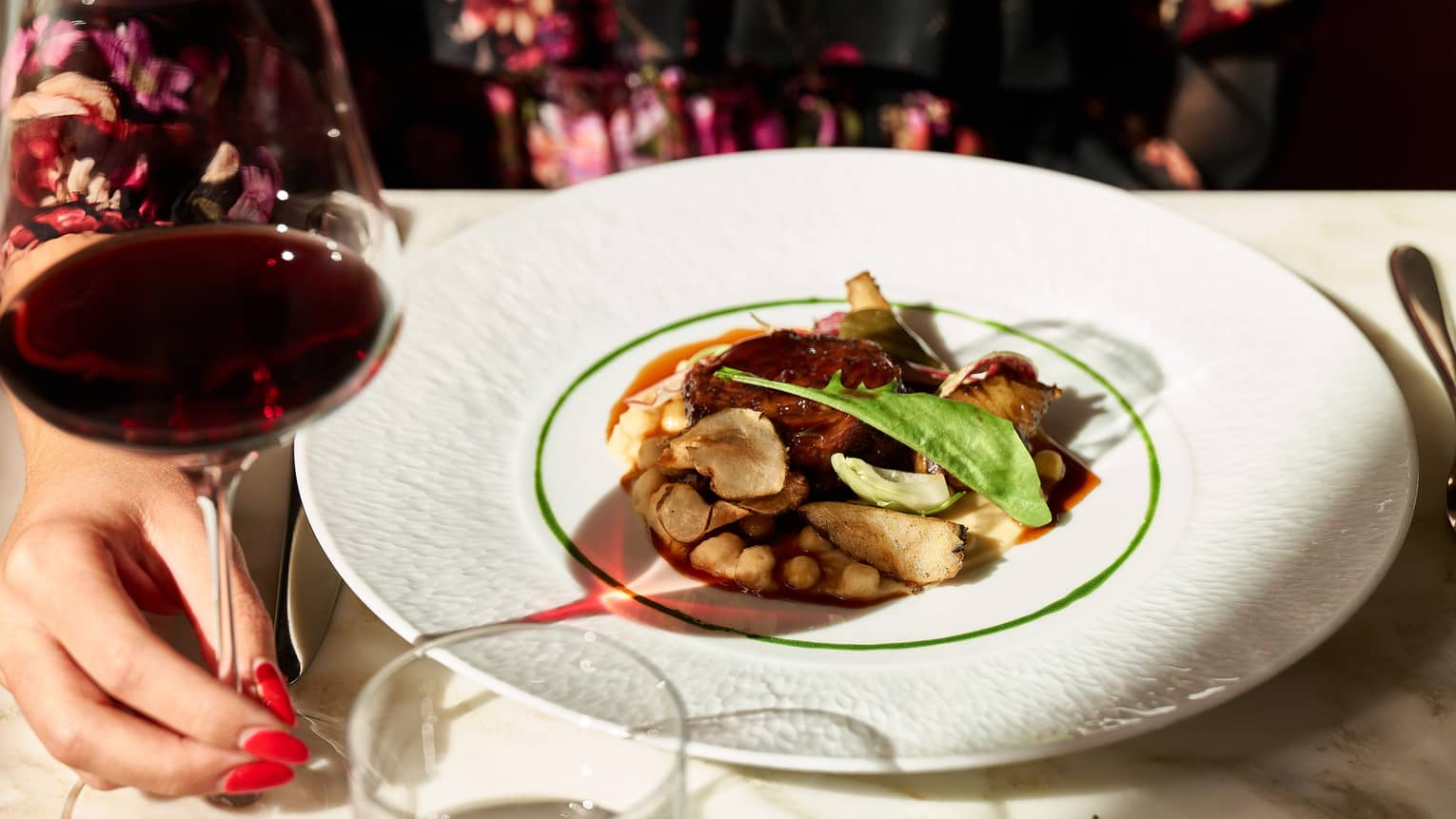Braised Lamb Chicory and glass of red wine