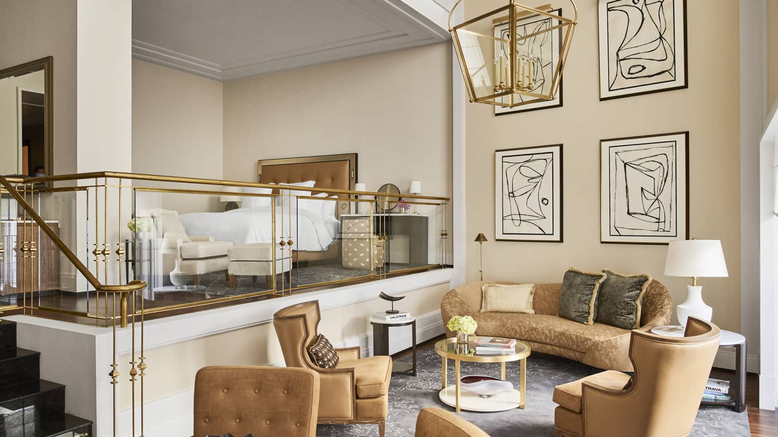 One-Bedroom Suite with elegant neutral décor, lower living room and stairs to loft bedroom