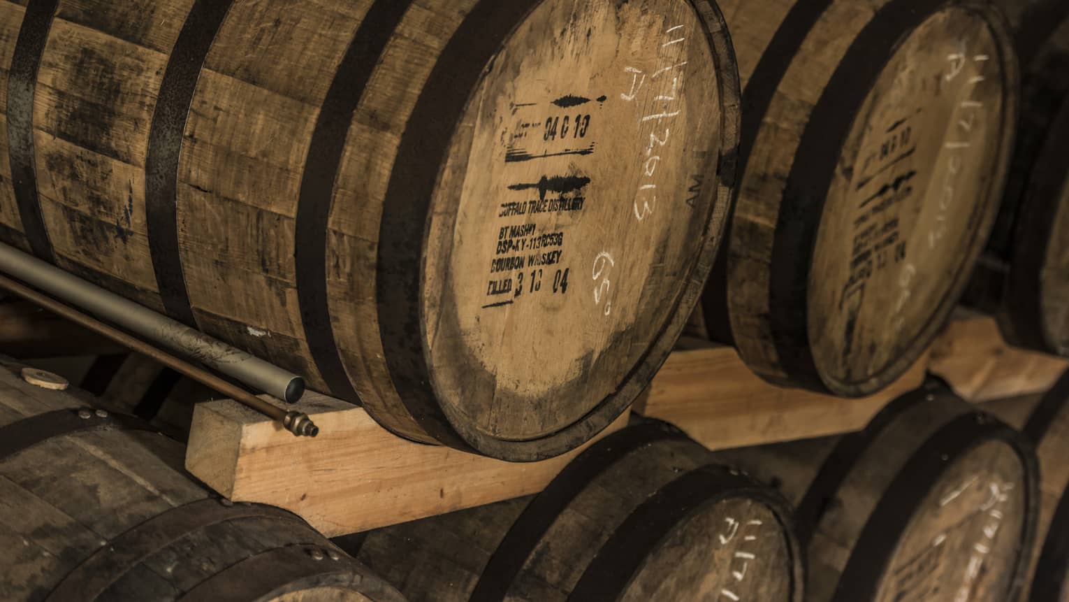 Rows of stacked rum barrels