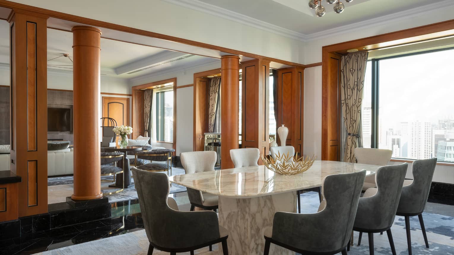 Presidential suite dining area with marble table and floor-to-ceiling windows
