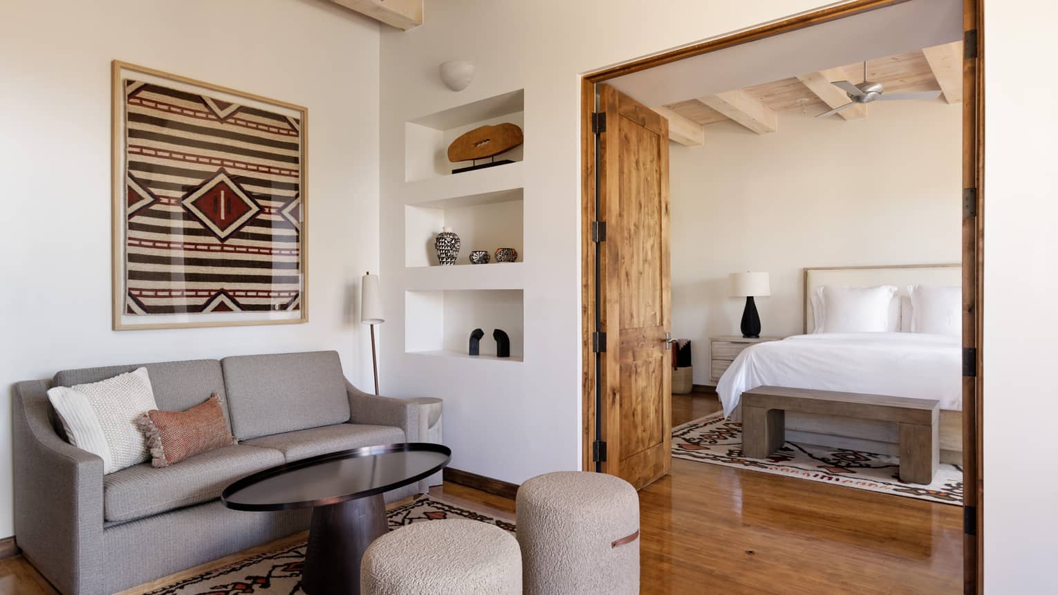 Hotel suite with bedroom and separate sitting area at Four Seasons Resort Santa Fe