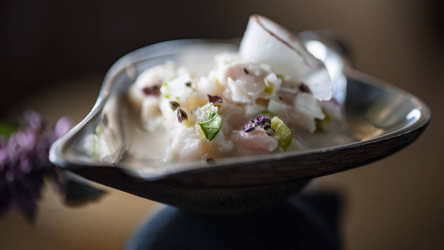 Raw fish in a small bowl.