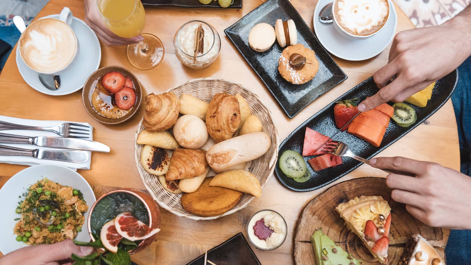 An assortment of pastries and desserts on a table.
