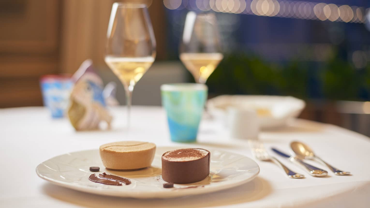 Deconstructed tiramisu on ecru plate set on elegant dining table