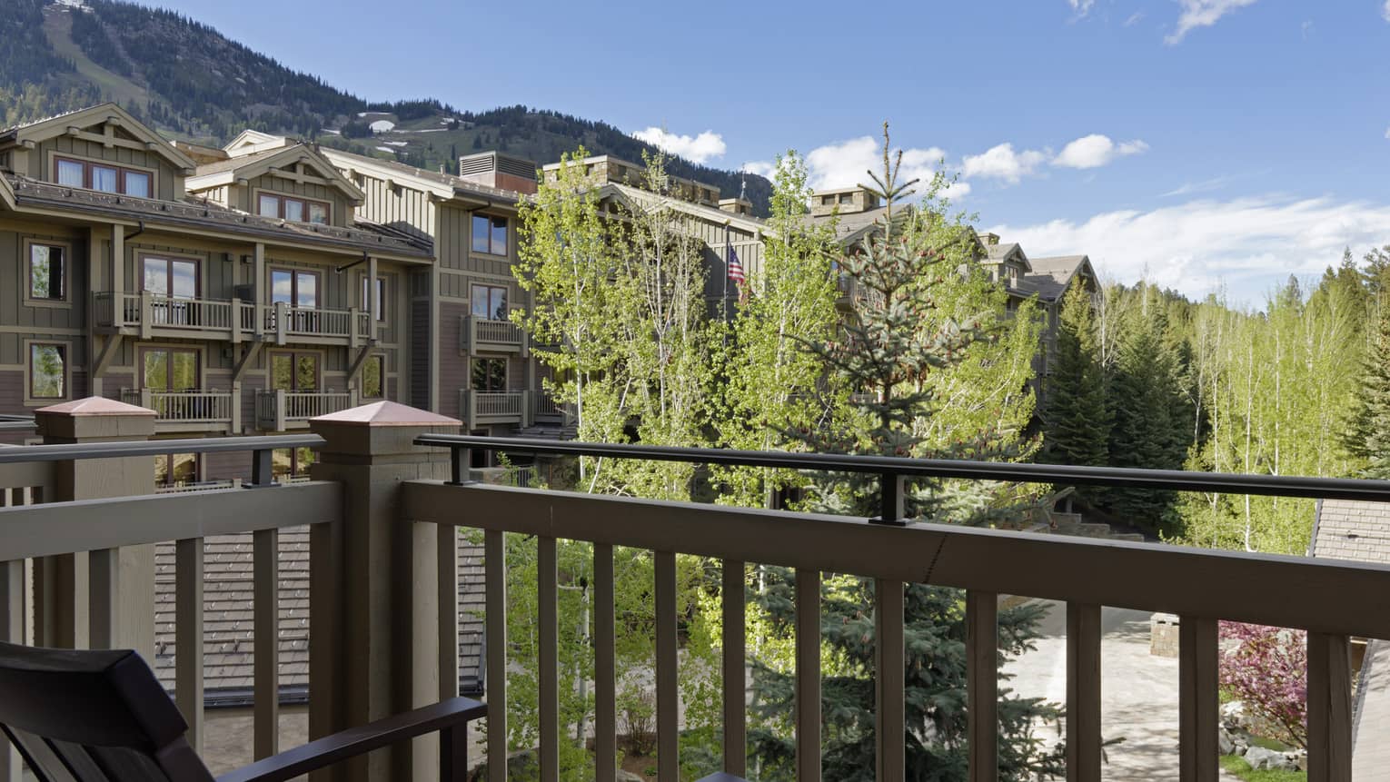 Hotel room balcony overlooking mountain resort
