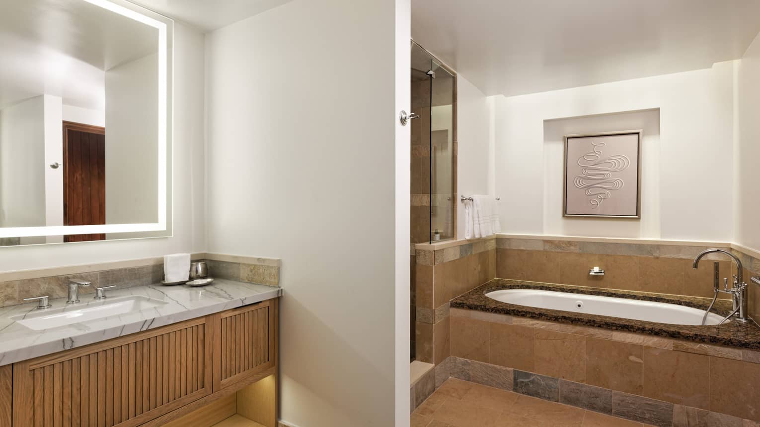 Large bathroom with marble countertops, sunken tub and separate walk-in shower