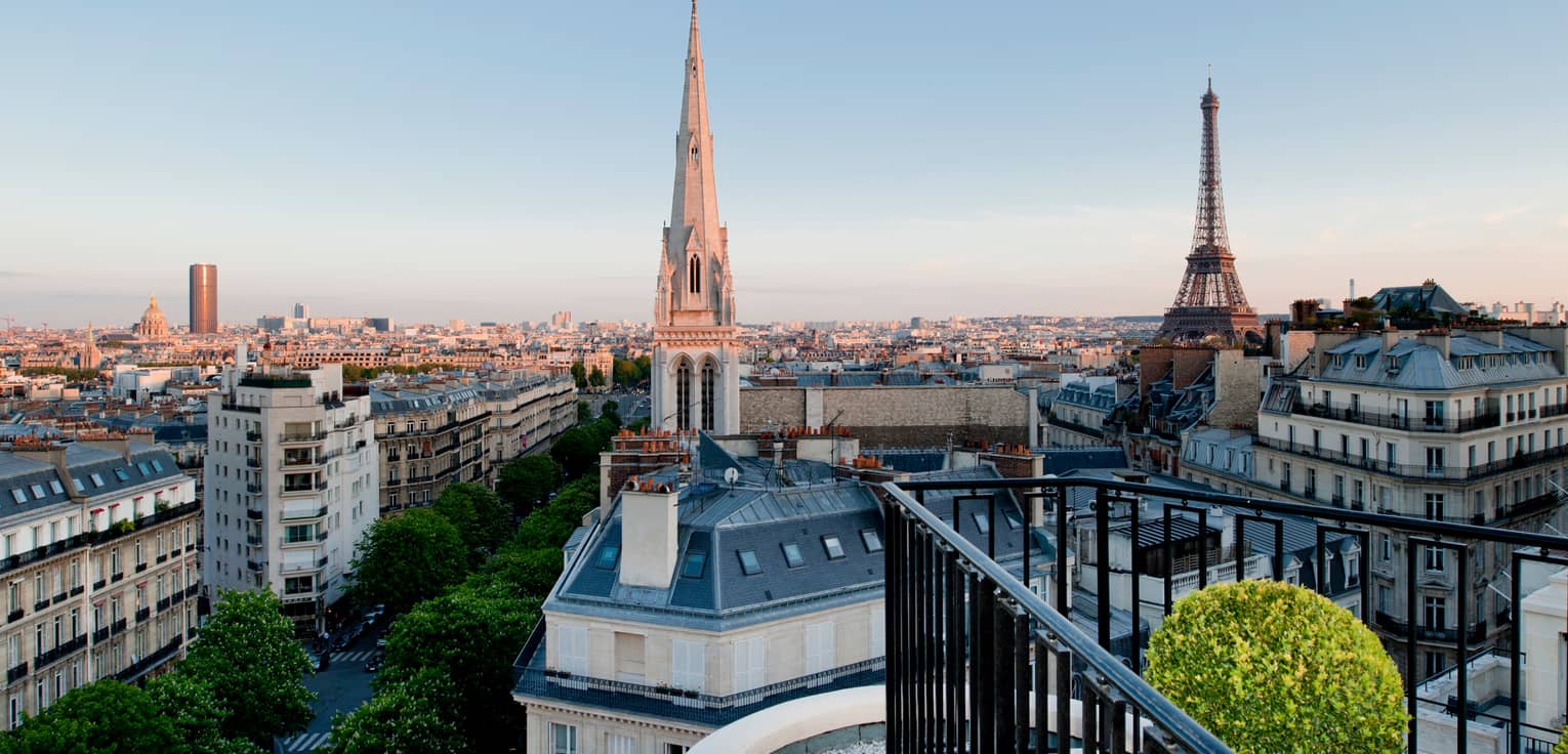 View over Paris rooftops, cathedral towers, Eiffel Tower