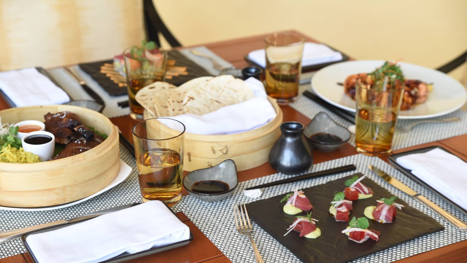 Close-up of gourmet appetizers on Metzeri at Aramara Restaurant private dining table