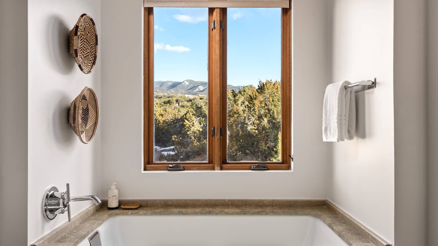 Bathroom with windowside sunken tub at Four Seasons Resort Santa Fe