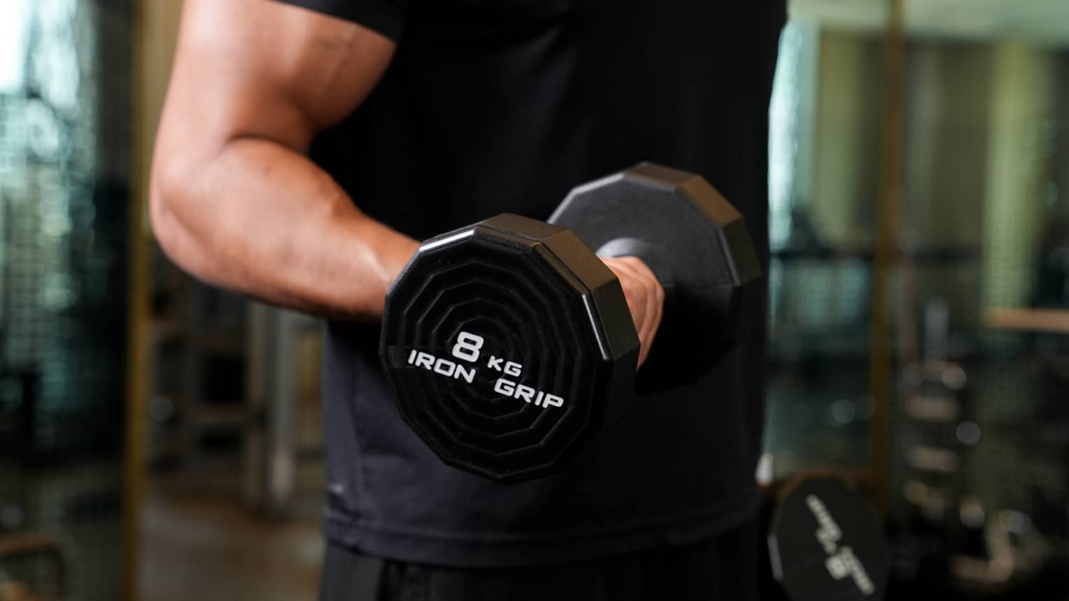A man lifting a dumbbell.