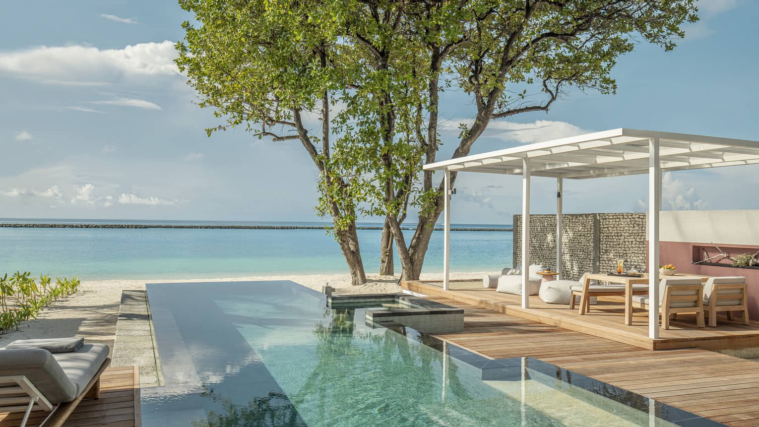 Private pool and lounge deck overlooking Maldivian ocean