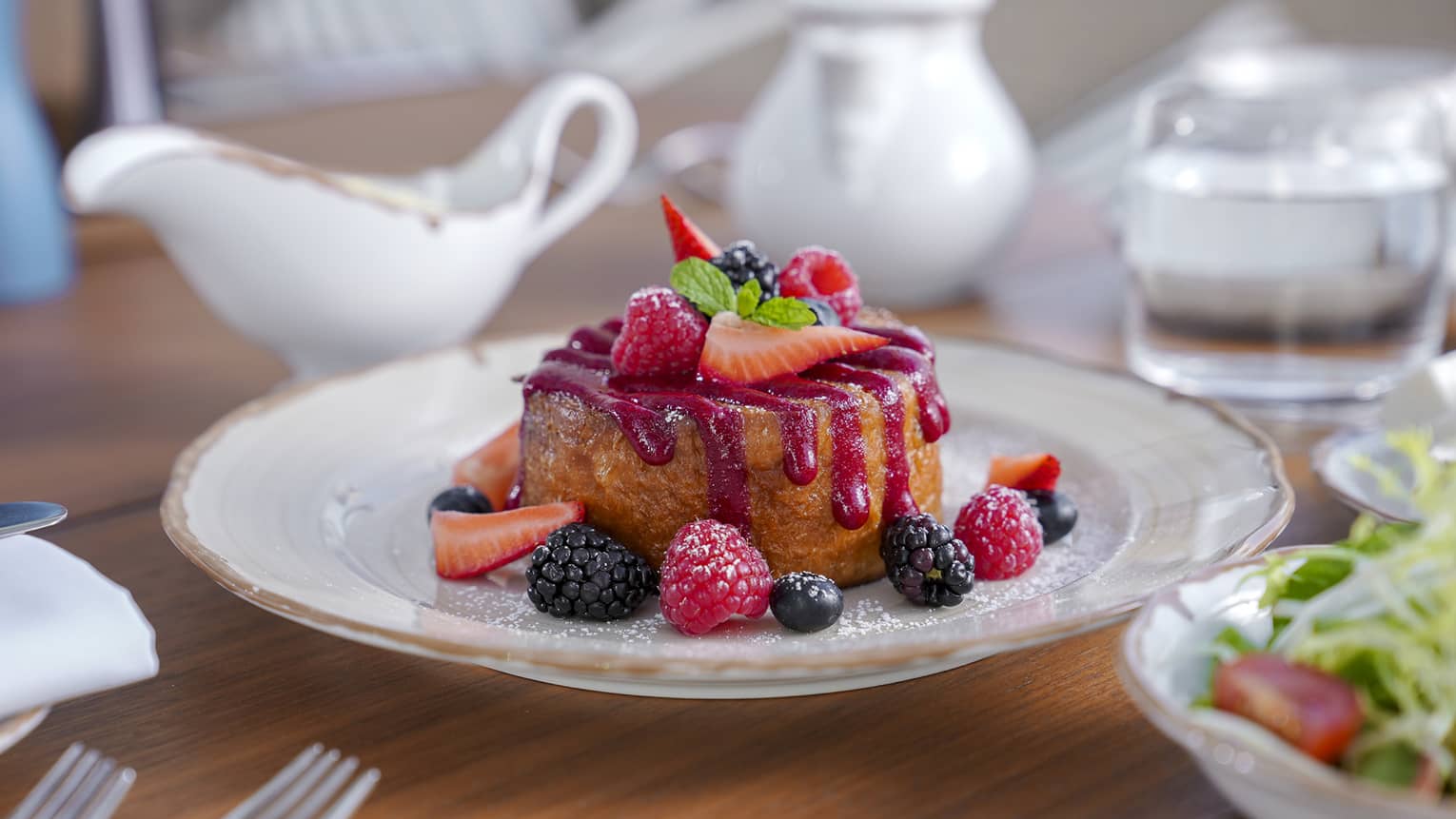 French toast with berries and a raspberry sauce.