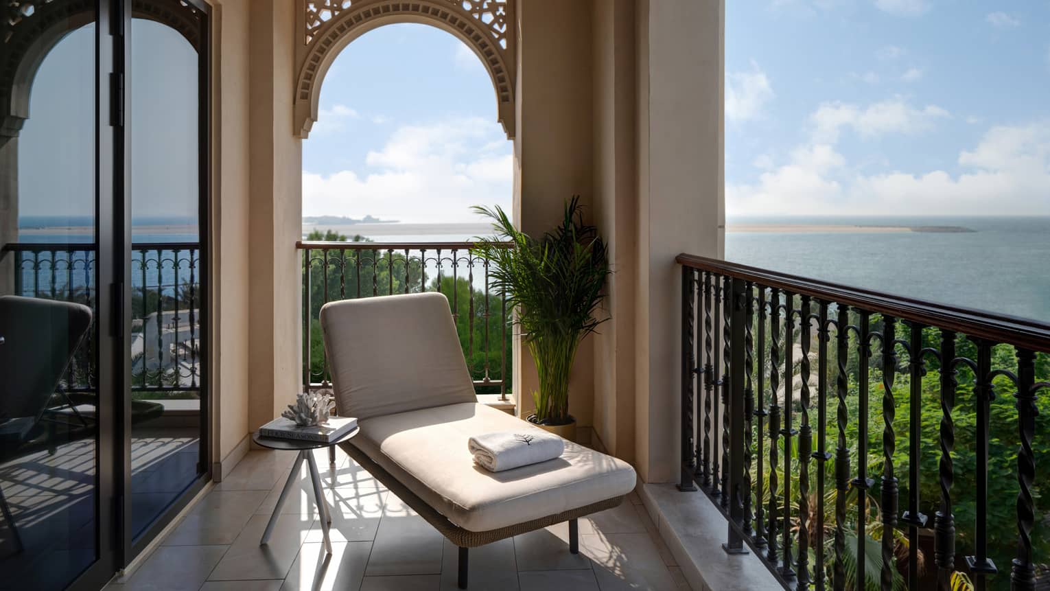 Balcony with lounge chair and sea view