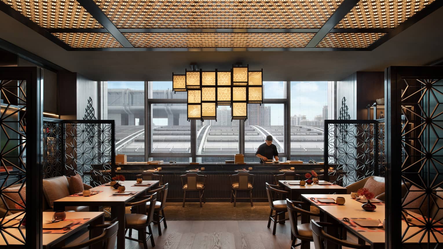 View of Teppanyaki counter at Matsuyi, downtown Shenzhen visible through floor-to-ceiling window