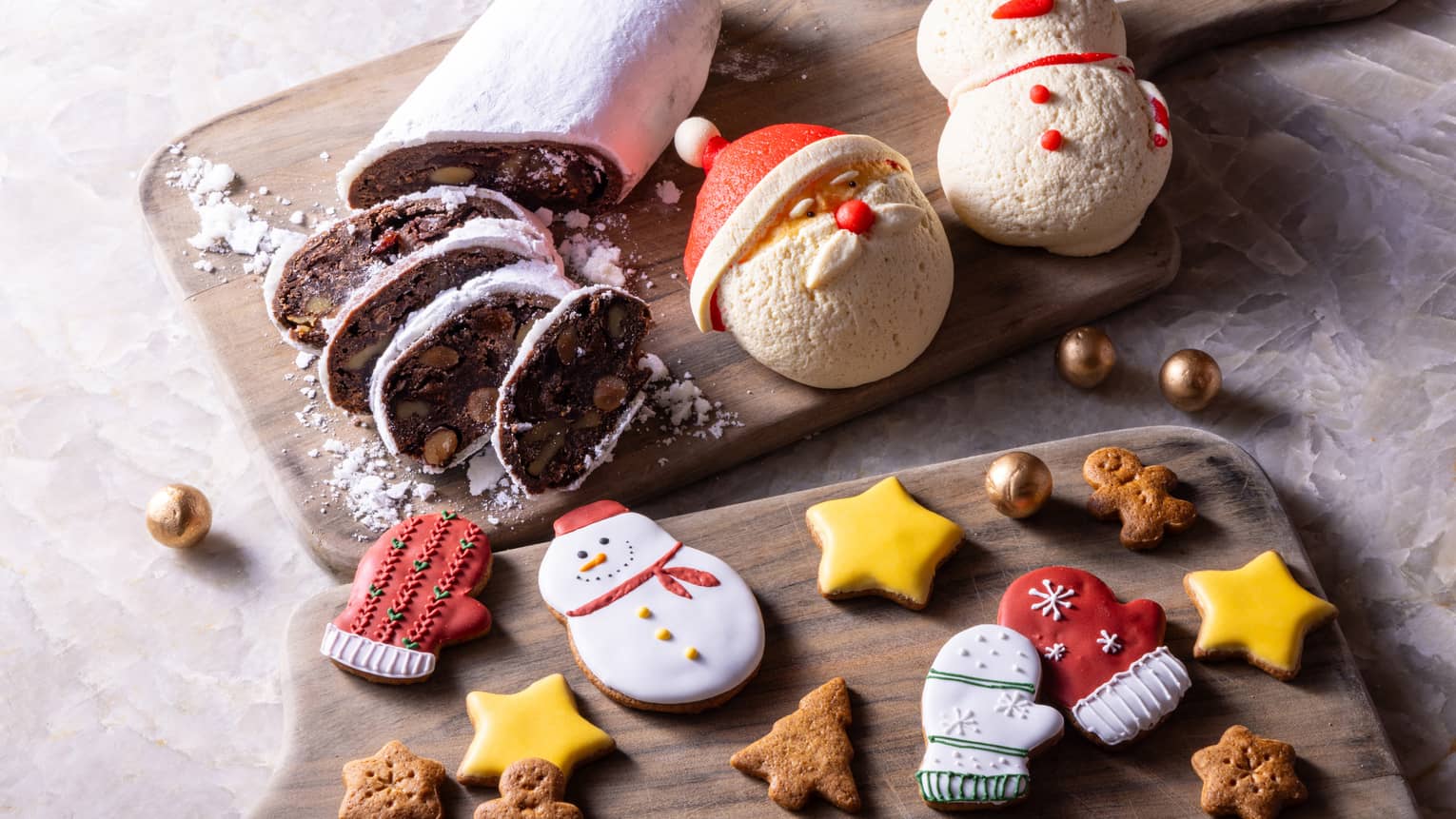 Christmas baked goods arranged on two wooden chopping boards